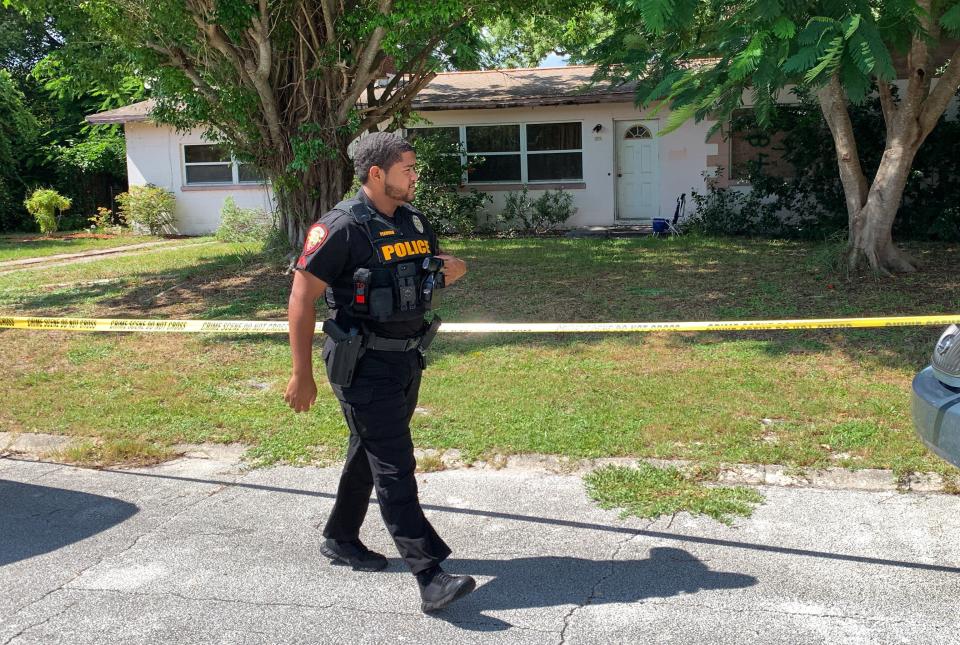 Melbourne police rope off home on Tanglewood Lane in the Eau Gallie area after two people were discovered dead inside Aug. 16, 2022.