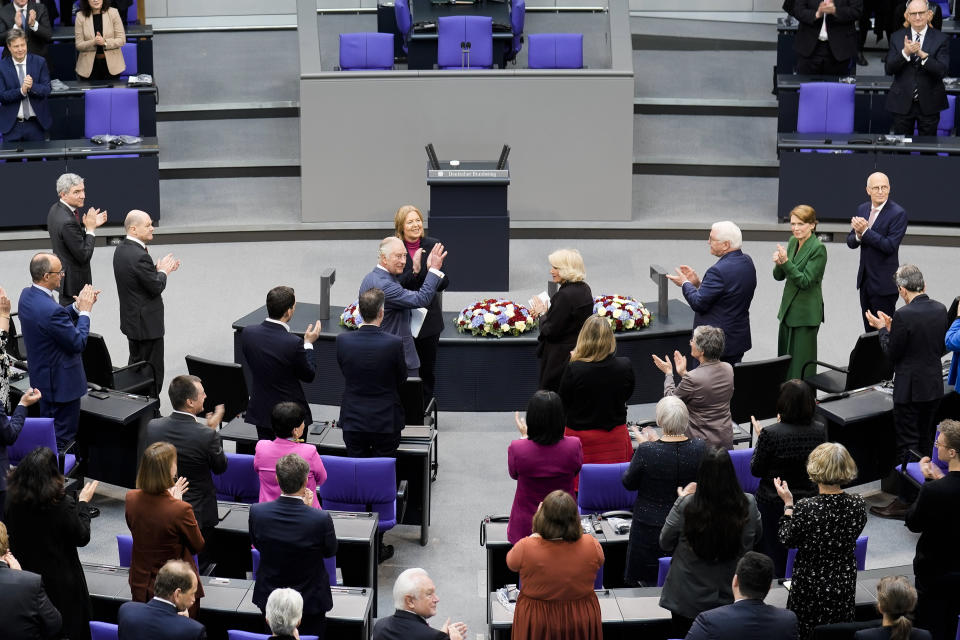 FILE - Britain's King Charles III, center left, waves as he receives a standing ovation after his speech in the German Bundestag in Berlin, Thursday, March 30, 2023. King Charles III won plenty of hearts during his three-day visit to Germany, his first foreign trip since becoming king following the death of his mother, Elizabeth II, last year. (AP Photo/Markus Schreiber, File)