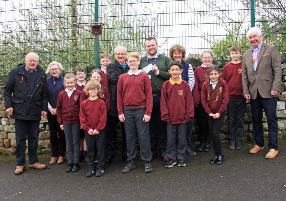 Darlington and Stockton Times: Northallerton club chairman, Bill Pye, teaching assistant Janet Allison, Northallerton DMC president, Geoff Simpson, headteacher, Matthew Scott, teacher, Rachel Grundman, and Northallerton DMC treasurer, Peter Gregory, with pupils at Chop Gate