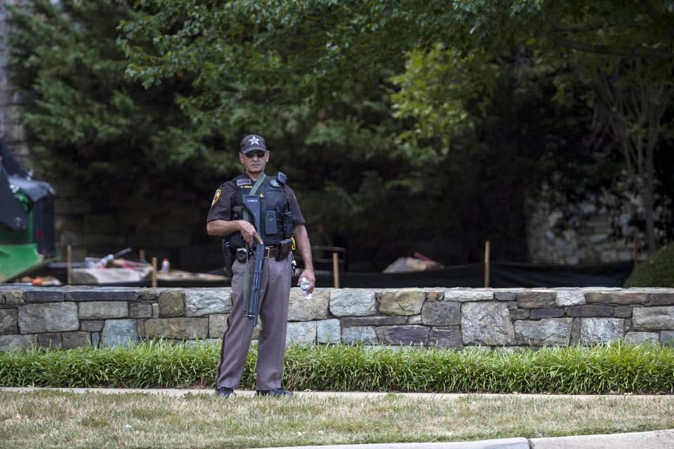 First responders are seen near the building that houses Gannett and USA Today, Wednesday, Aug. 7, 2019, in McLean, Va. (AP Photo/Alex Brandon)