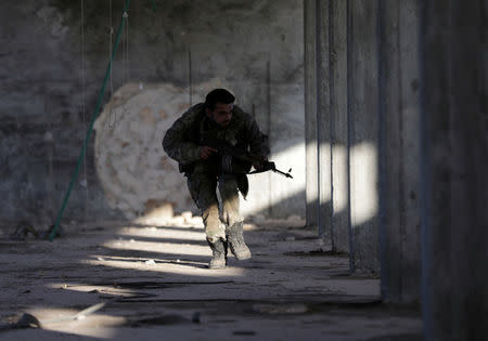 A Turkey-backed Free Syrian Army fighter is seen in the eastern suburbs of al-Bab, Syria February 8, 2018. REUTERS/Khalil Ashawi