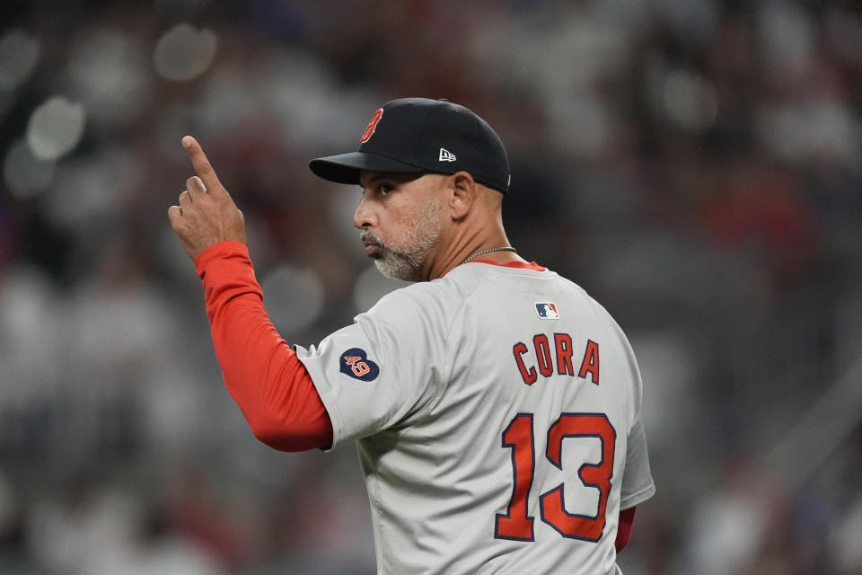 Boston Red Sox manager Alex Cora makes a pitching change in the seventh inning of a baseball game against the Atlanta Braves Tuesday, May 7, 2024, in Atlanta. (AP Photo/John Bazemore)