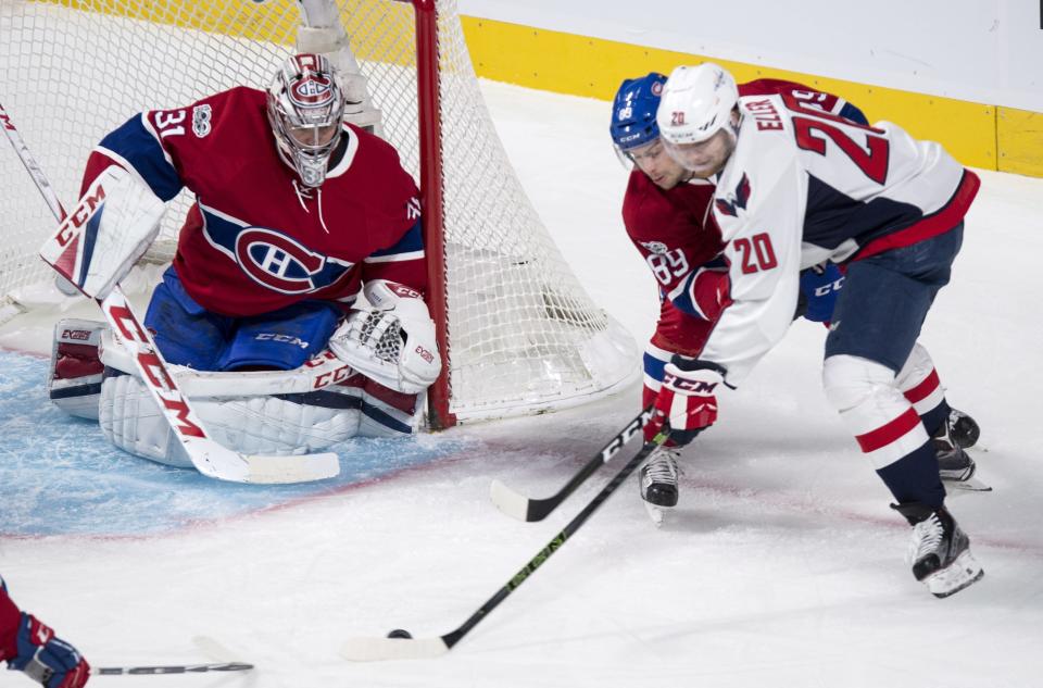 Montreal Canadiens defenseman Ryan Johnston (89) blocks Washington Capitals centre Lars Eller (20) from taking a shot on goaltender Carey Price (31) during the first period of an NHL hockey game Monday, Jan. 9, 2017, in Montreal. (Paul Chiasson/The Canadian Press via AP)