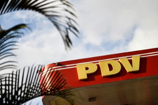 The United States is banning exports by Venezuelan state-owned oil company PDVSA, whose logo is seen here at a gas station in Caracas