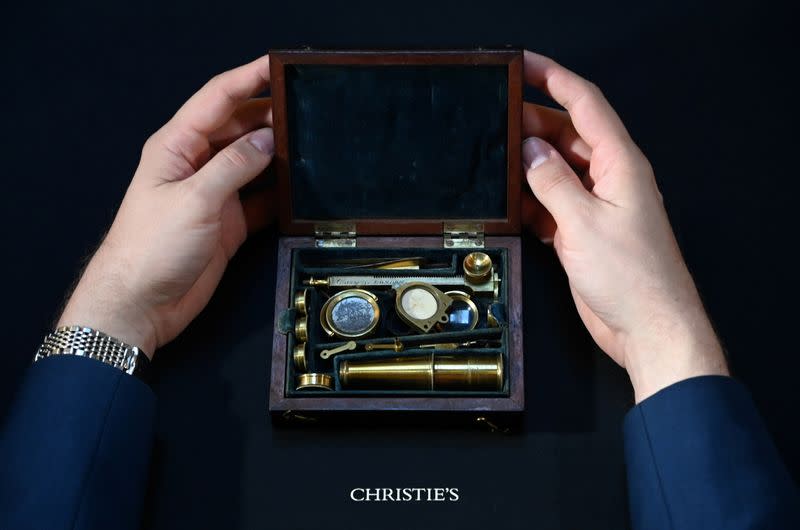 Darwin Family Microscope, owned and used by the English naturalist, Charles Darwin, demonstrated ahead of auction at Christie's, London