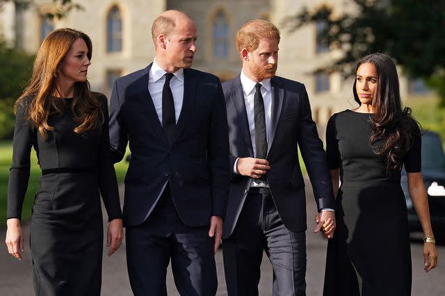 <p>KIRSTY O'CONNOR/POOL/AFP via Getty</p> Kate Middleton, Prince William, Prince Harry and Meghan Markle on the long Walk at Windsor Castle on September 10, 2022.