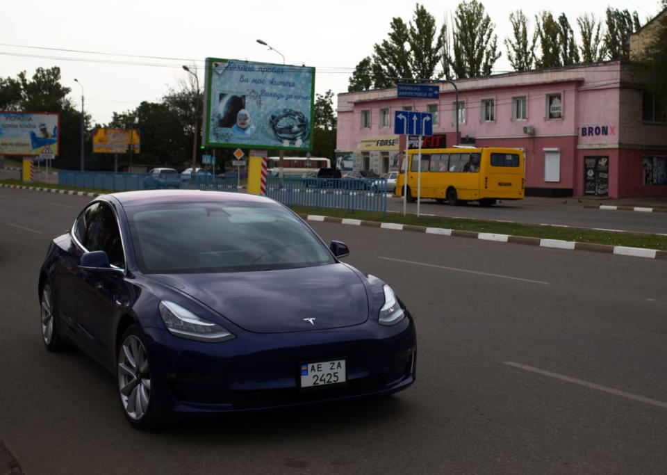 <div class="inline-image__caption"><p>Tesla Model III parked outside the local pub in Nikopol, Ukraine. </p></div> <div class="inline-image__credit">Tom Mutch</div>