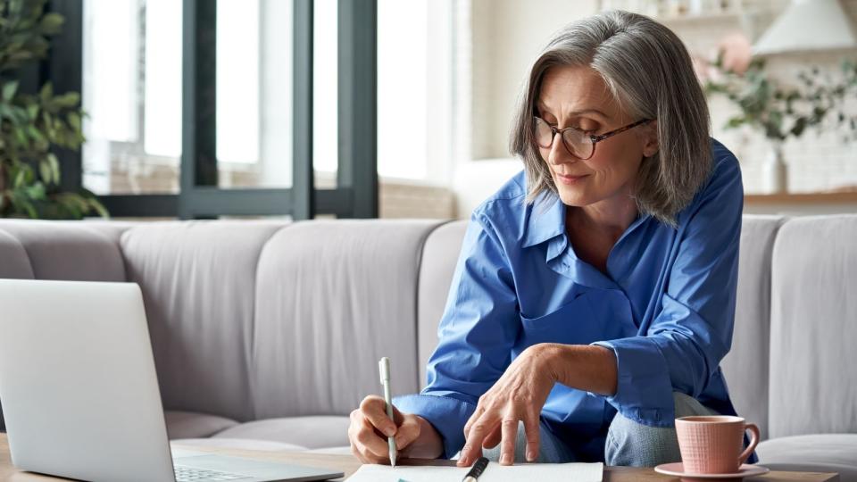 older woman doing super calculations 