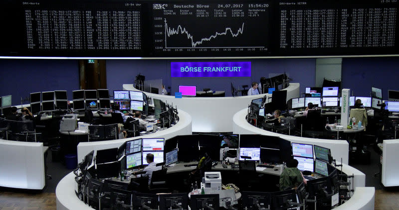 Traders work in front of the German share price index, DAX board, at the stock exchange in Frankfurt, Germany, July 24, 2017. REUTERS/Staff/Remote