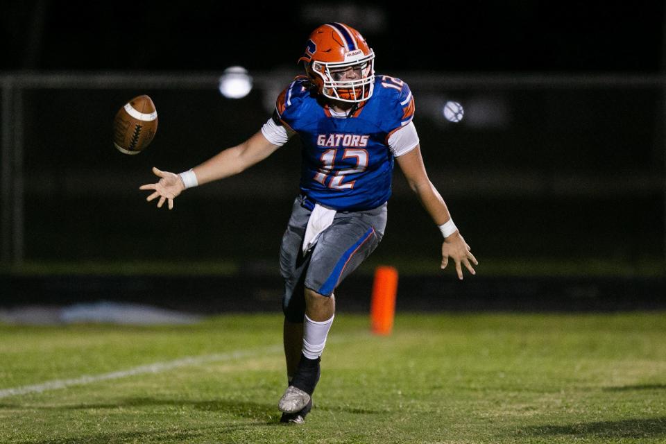 Palm Beach Gardens quarterback Brand Campbell (12) celebrates a touchdown in the second quarter of the Class 4M regional quarterfinal game between host Palm Beach Gardens and Wellington on Monday, November 14, 2022, in Palm Beach Gardens, FL. Final score, Palm Beach Gardens, 30, Wellington, 13.