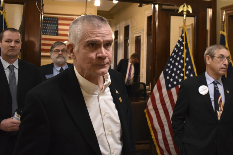 Republican Rep. Matt Rosendale leaves the Montana Secretary of State's office after filing paperwork to run for U.S. Senate, Friday, Feb. 9, 2024, at the state capitol in Helena, Mont. Rosendale is entering the race after GOP leaders in the senate had discouraged him from running. (AP Photo/Matthew Brown)