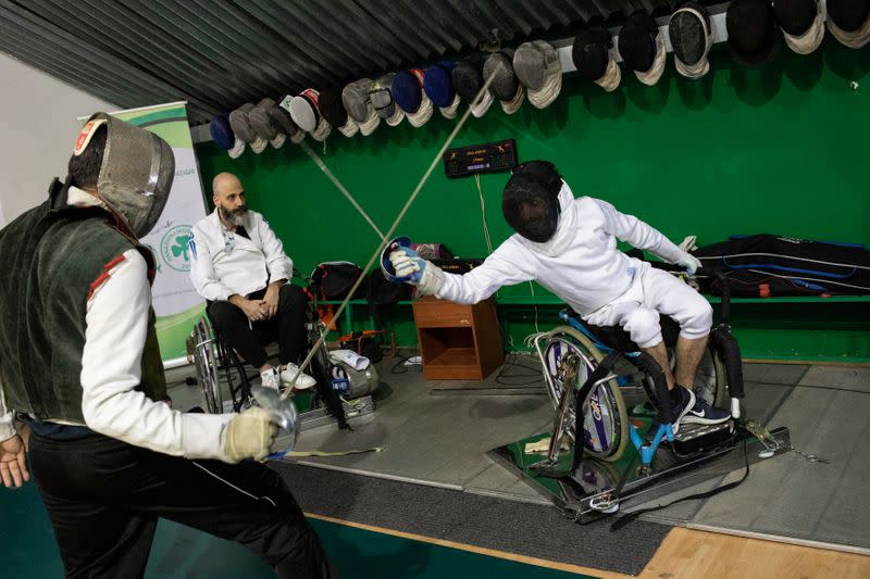 Wisam Sami, a 29 year-old Iraqi refugee, trains wheelchair fencing at Apostolos Nikolaidis stadium in Athens