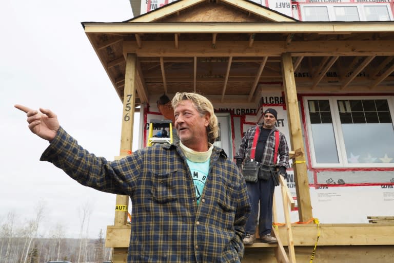 Steven Menard says he has lost 42 pounds (19 kg) rebuilding his home in Fort McMurray after it was destroyed one year ago in a massive forest fire