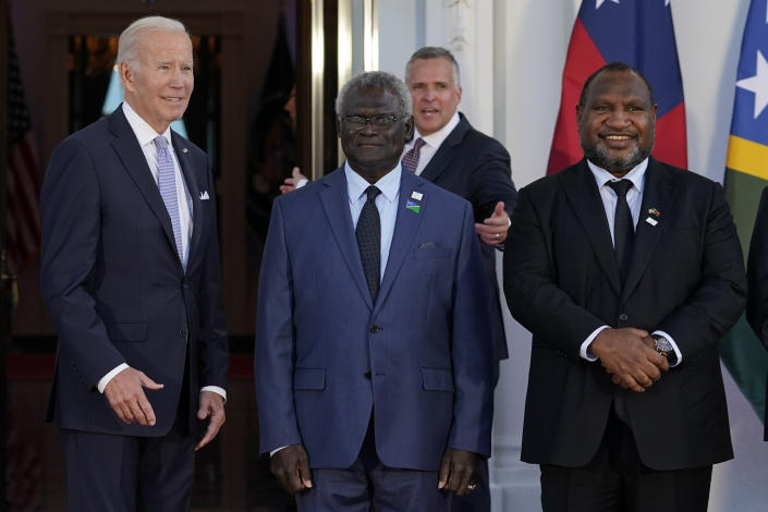 FILE - President Joe Biden poses for photos with Pacific Island leaders including Solomon Islands Prime Minister Manasseh Sogavare, center, and Papua New Guinea Prime Minister James Marape on the North Portico of the White House in Washington, Sept. 29, 2022. Biden has an ambitious agenda when he sets off later this week on an eight-day trip to the Indo-Pacific. He’s looking to tighten bonds with longtime allies, make history as the first sitting U.S. president to visit the tiny island of Papua New Guinea, and spotlight his administration’s commitment to the Pacific. (AP Photo/Susan Walsh, File)