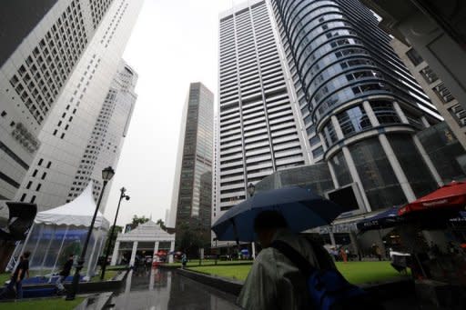 This file photo shows high-rises of the financial district in Singapore. Singapore has cleared the sale of Formula One shares for more than US$2.5 billion in one of the world's biggest flotations this year, reports said on Tuesday, with pre-marketing to begin immediately