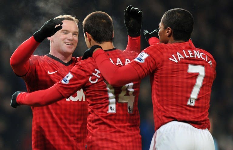 Manchester United striker Wayne Rooney (L) celebrates scoring the only goal in the FA Cup third-round replay win over West Ham at Old Trafford on January 16, 2013. But the England man wasted a chance to put the result beyond doubt when he blazed over a penalty 12 minutes from time