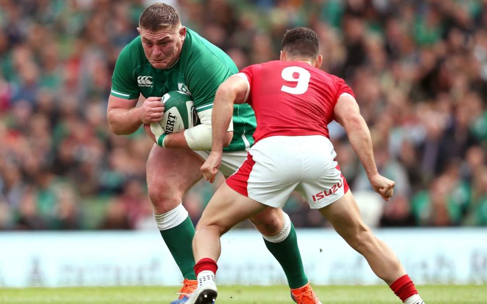 Ireland's Tadhg Furlong (left) and Wales' Tomos Williams battle for the ball during the Guinness Summer Series match at the Aviva Stadium, Dublin. PA Photo. Picture date: Saturday September 7, 2019 - Brian Lawless/PA Wire