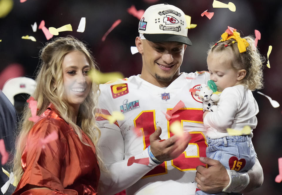 Kansas City Chiefs quarterback Patrick Mahomes (15) and his wife Brittany, left, celebrate with their daughter, Sterling Skye Mahomes
 (Seth Wenig / AP)