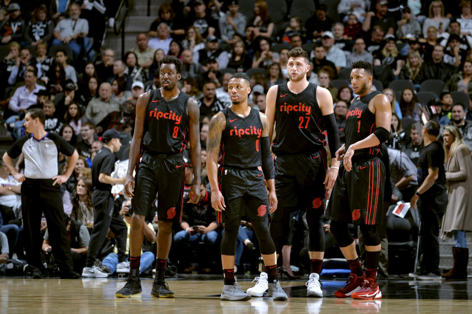 MVP candidate Damian Lillard (second from left) will need some help from the likes of Al-Farouq Aminu (left), Jusuf Nurkic (third from left) and Evan Turner for Portland to make a deep postseason run. (Getty)