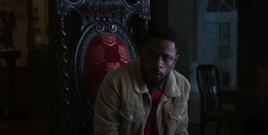 LaKeith Stanfield sitting on an ornate chair