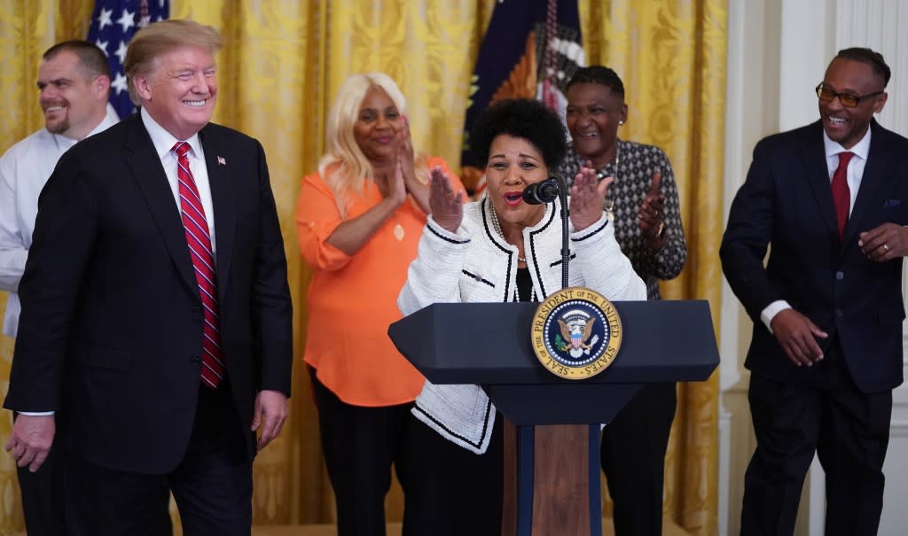 Alice Marie Johnson (center), among those whose sentences were commuted by then-President Donald Trump (left), celebrates the First Step Act, which passed in December 2018 with bipartisan support. (Photo: Chip Somodevilla/Getty Images)