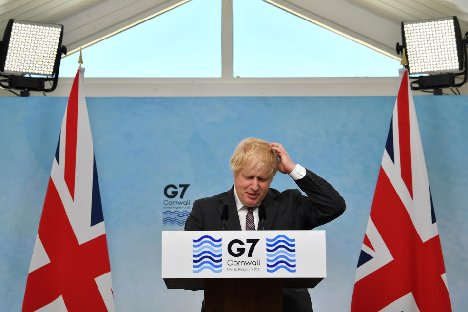 <p>CARBIS BAY, CORNWALL - JUNE 13:  British Prime Minister Boris Johnson takes part in a press conference on the final day of the G7 summit in Carbis Bay on June 13, 2021 in Cornwall, United Kingdom. UK Prime Minister, Boris Johnson, hosts leaders from the USA, Japan, Germany, France, Italy and Canada at the G7 Summit. This year the UK has invited India, South Africa, and South Korea to attend the Leaders' Summit as guest countries as well as the EU. (Photo by Ben Stansall - WPA Pool/Getty Images)</p>
