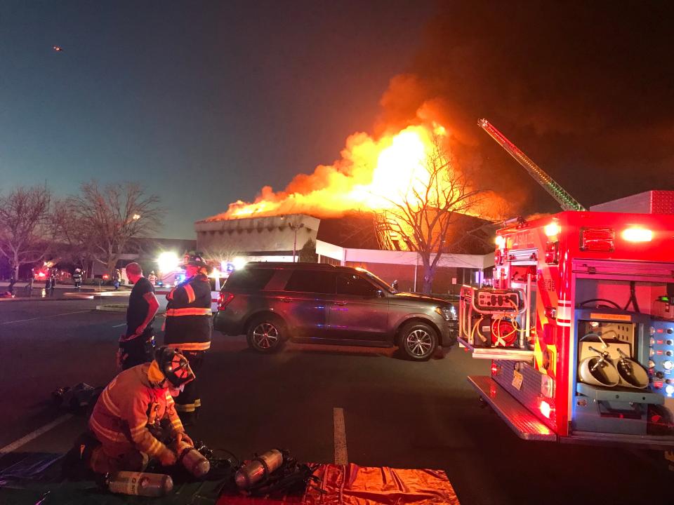 Flames shoot through the roof of the sanctuary as crews battle a massive blaze at Fountain of Life center in Florence, Monday March 20.