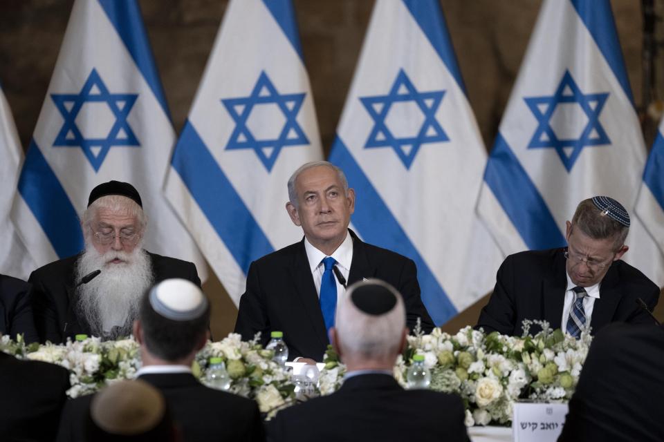 Israel's Prime Minister Benjamin Netanyahu, center, pauses at the weekly cabinet meeting, in the Western Wall tunnels in the Old City of Jerusalem, Sunday, May 21, 2023. (AP Photo/ Maya Alleruzzo, Pool)