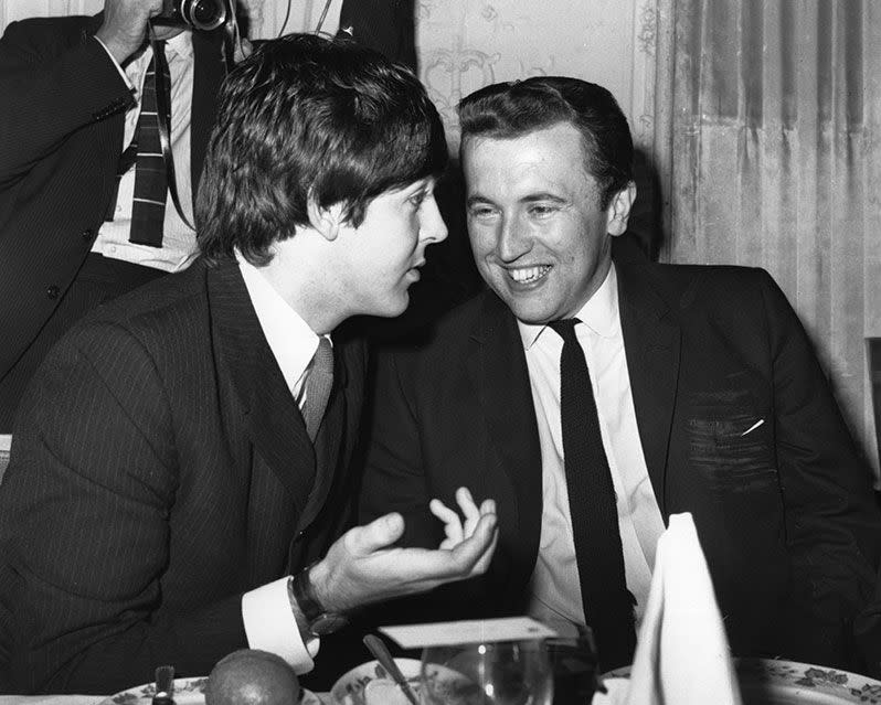 Frost at an awards ceremony with Paul McCartney of the Beatles in 1965. Credit: Keystone/Getty