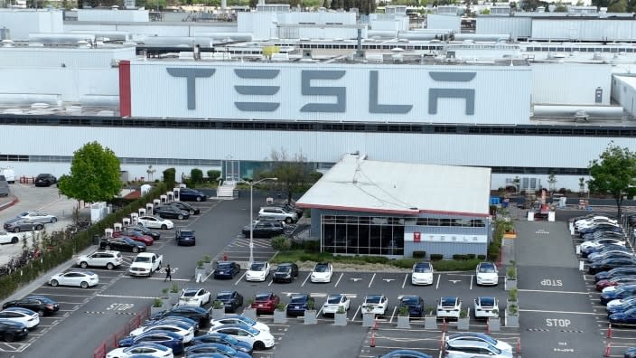 In an April aerial view, Tesla cars sit parked in a lot at the Tesla factory in Fremont, California. (Photo: Justin Sullivan/Getty Images)