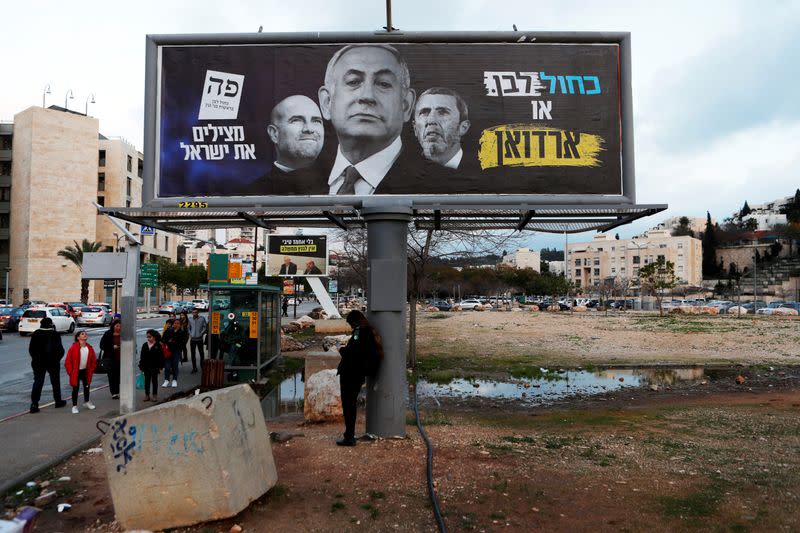 A Blue and White party election campaign banner depicting Israeli Prime Minister Benjamin Netanyahu is seen in Modiin, Israel