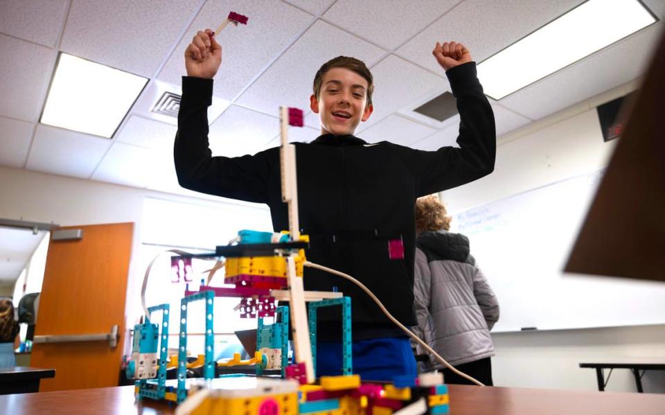 Eighth grader Nate Gause celebrates making a hole in one on his “Mini Mini Golf” lego robotics game during the Mason Middle School annual robotics carnival in Tacoma, Washington, on Thursday, June 13, 2024.