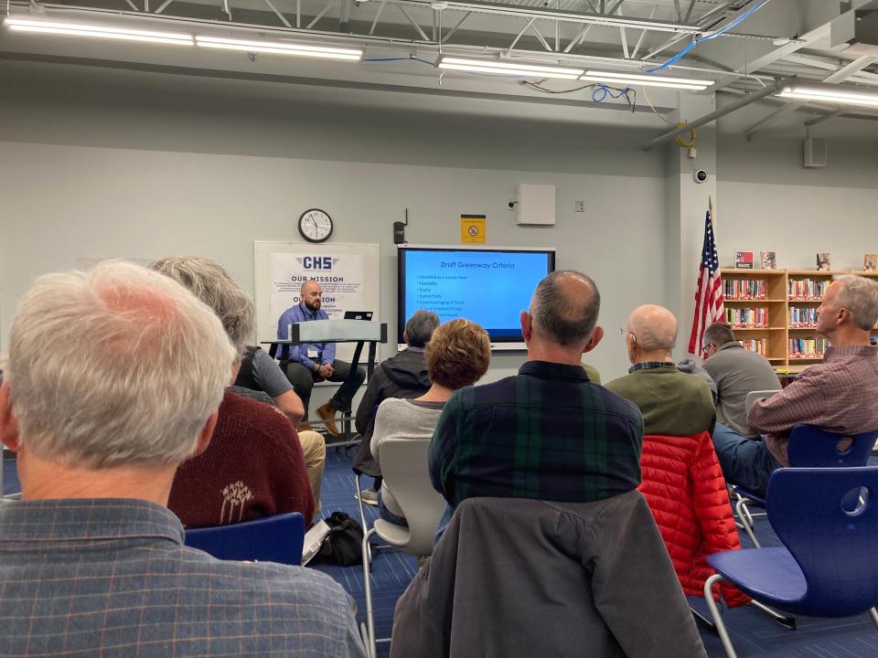 Principal Park Planner Thomas Gull presents to a room of residents at Community High School in Swannanoa on March 15.