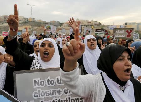 Israeli Arab women protesters shout slogans during a demonstration against the outlawing of the Islamic Movement's northern branch, in the northern Israeli-Arab town of Umm el-Fahm November 28, 2015. REUTERS/Ammar Awad