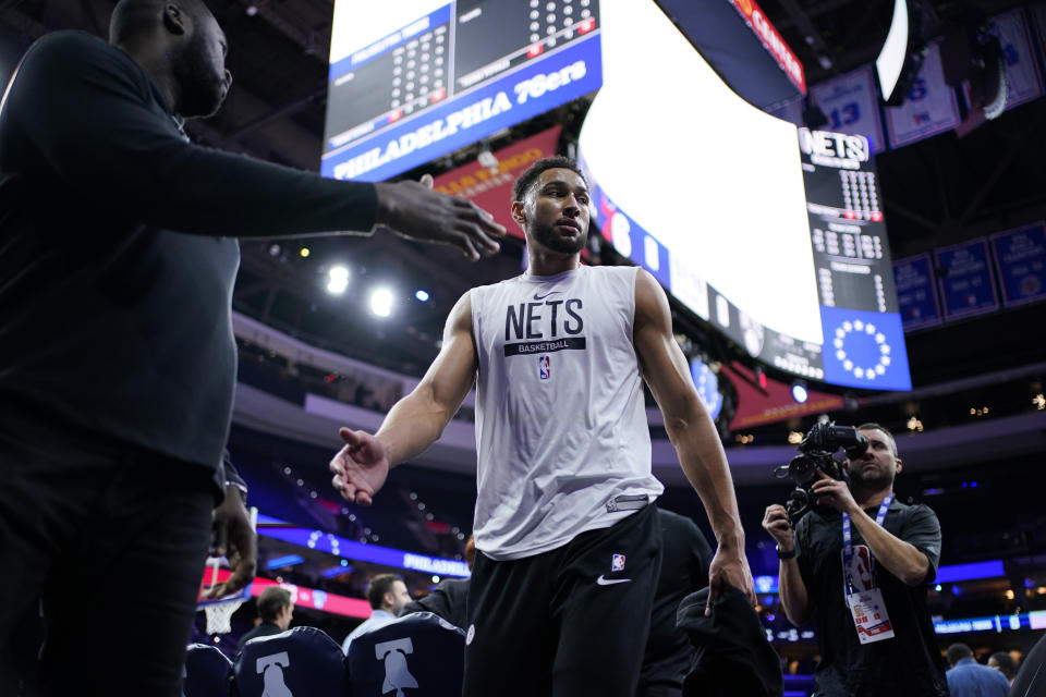 Brooklyn Nets' Ben Simmons walks off the court after warming up before an NBA basketball game against the Philadelphia 76ers, Tuesday, Nov. 22, 2022, in Philadelphia. (AP Photo/Matt Slocum)