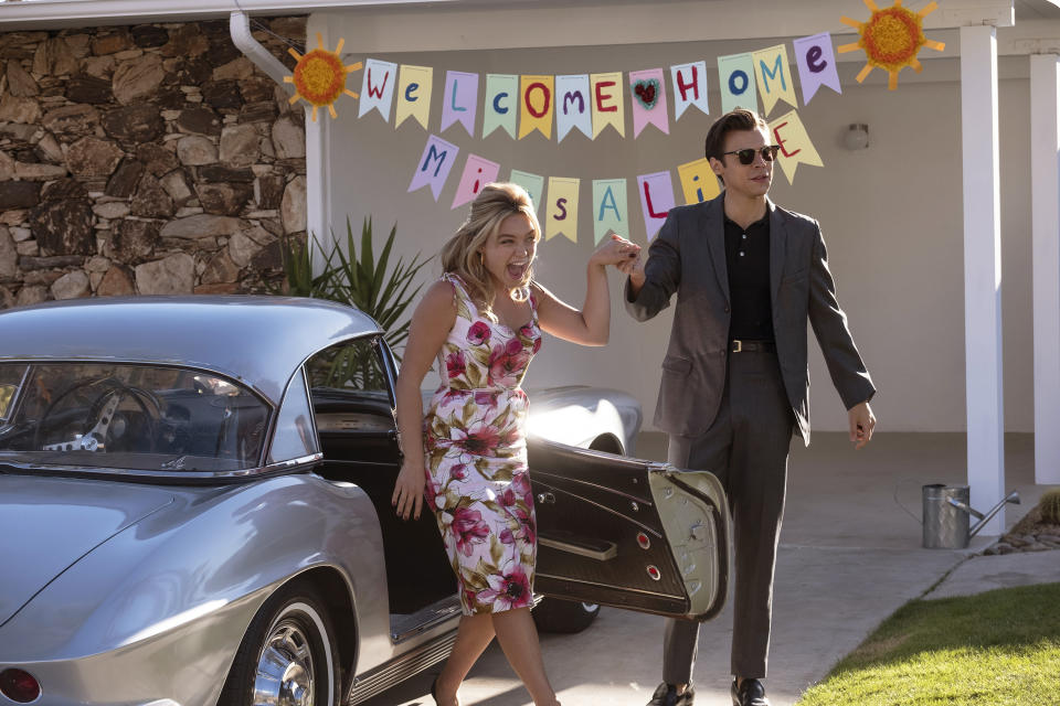 This image released by Warner Bros. Entertainment shows Florence Pugh, left, and Harry Styles in a scene from "Don't Worry Darling." (Warner Bros. Entertainment via AP)