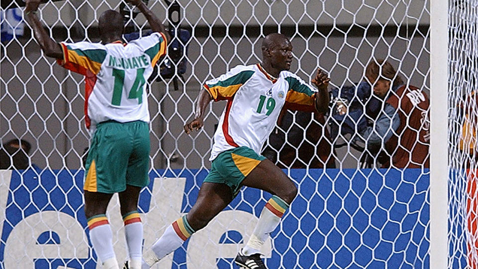 Diop is seen here celebrating his famous goal against France at the 2002 World Cup.