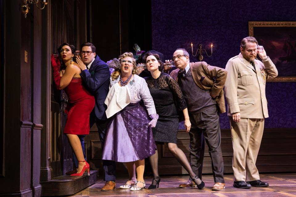 From left, appearing in "Clue" are Sarah Hollis as Miss Scarlet; Alex Mandell as Mr. Green; Kathy Fitzgerald as Mrs. Peacock; Donna English as Mrs. White; Michael Kostroff as Professor Plum; and John Treacy Egan as Colonel Mustard.