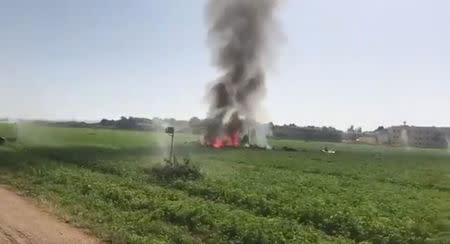 Smoke billows from the wreckage of a Eurofighter combat jet after it crashed near a military base in Albacete, in southeastern Spain, October 12, 2017 in this still images obtained from social media video. SILVIA AND JUANMI MONJE DE ALBACETE/ via REUTERS