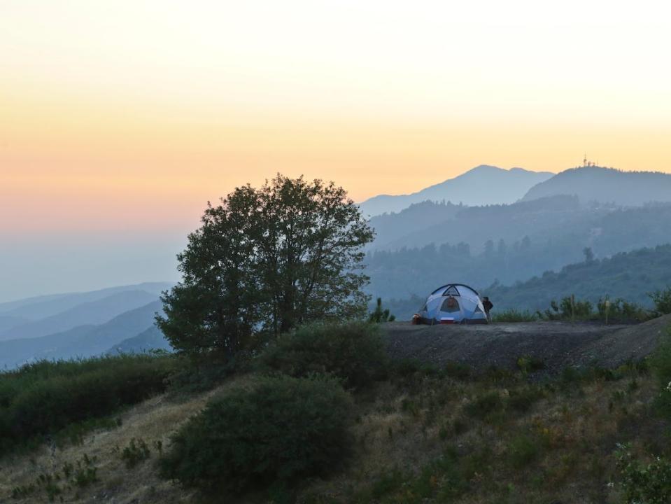 A tent on a beautiful campground.