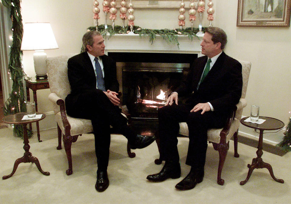 Vice President Al Gore (R) meets with President-elect George W. Bush in the living room of the vice president's residence in Washington, December 19, 2000. Bush and Gore met for the first time since the final debate during the election campaign.