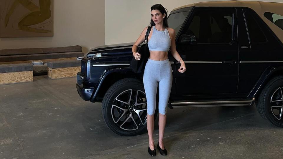 Kendall Jenner wears a matching grey Alo yoga set 