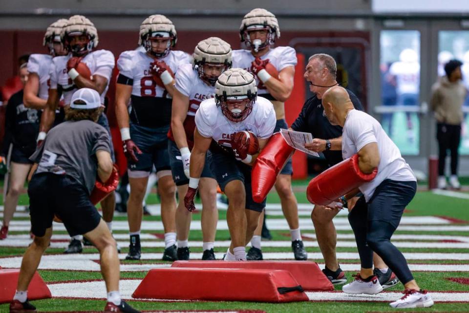 Tight end coach Shawn Elliott works with the tight ends during spring practice inside the Jerri and Steve Spurrier Indoor Practice Facility on Thursday, April, 11, 2024.