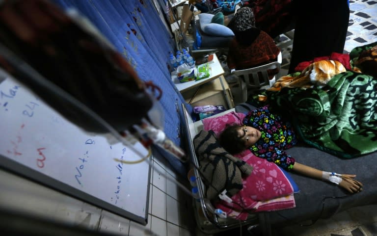 A wounded Iraqi child receives medical treatment at a hospital in Arbil on December 19, 2016