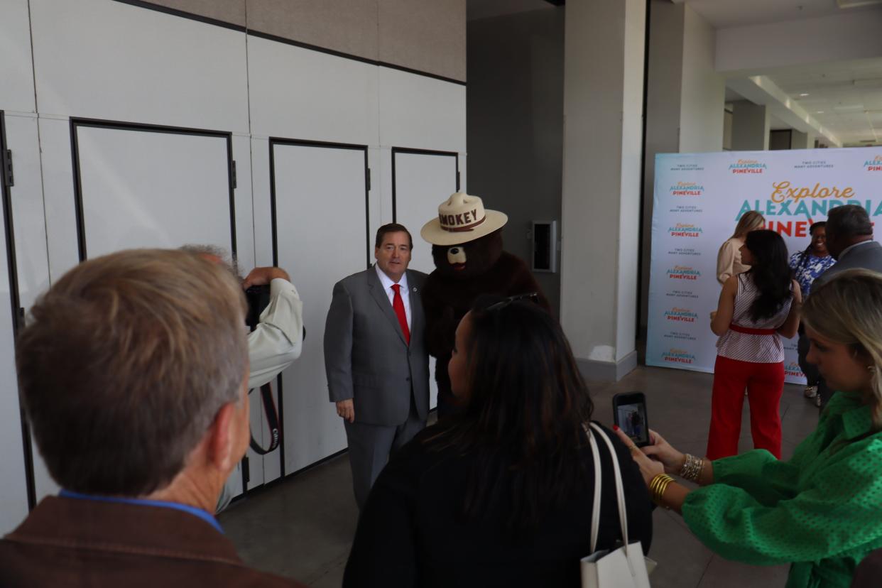 Louisiana Lt. Gov. Billy Nungesser poses with the U.S. Forest Service's Smokey Bear on Monday as he walks into the Alexandria/Pineville Convention and Visitors' Bureau annual tourism luncheon. Nungesser was the featured speaker at the event, which also showcased what the region has to offer for residents and non-residents.