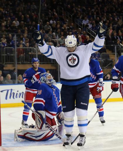 NEW YORK, NY - APRIL 01: Nik Antropov #80 of the Winnipeg Jets scores at 1:15 of the first period against Henrik Lundqvist #30 of the New York Rangers at Madison Square Garden on April 1, 2013 in New York City.  (Photo by Bruce Bennett/Getty Images)