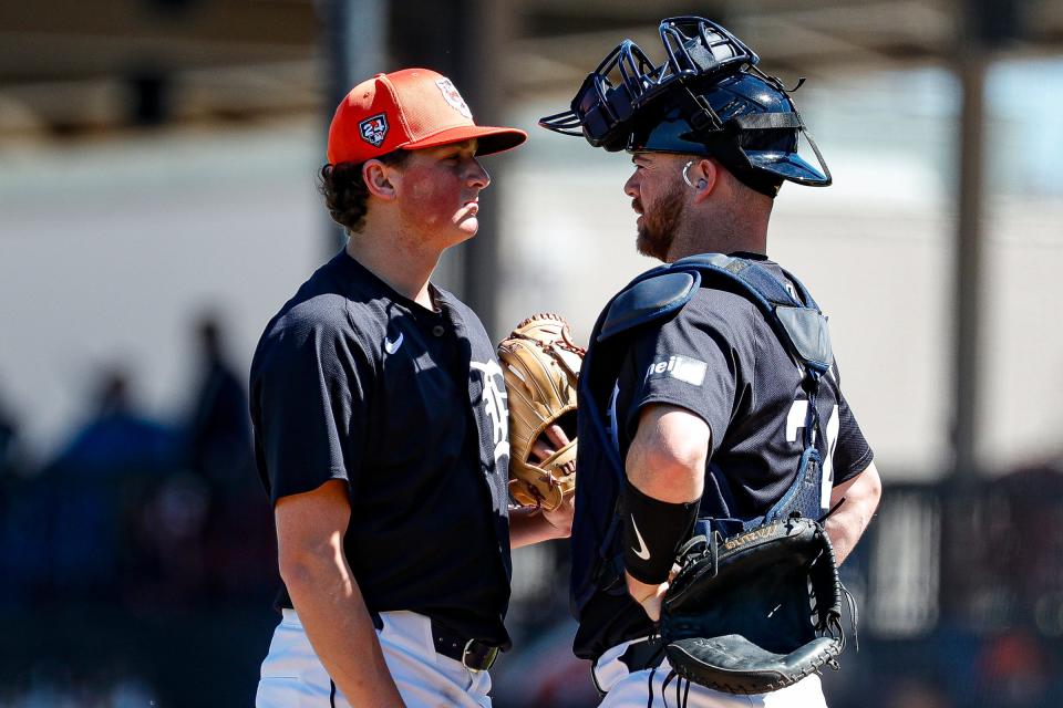 Tigers pitcher Reese Olson talks to catcher Jake Rogers during the first inning of the Grapefruit League season opener at Joker Marchant Stadium in Lakeland, Florida, on Saturday, Feb. 24, 2024.