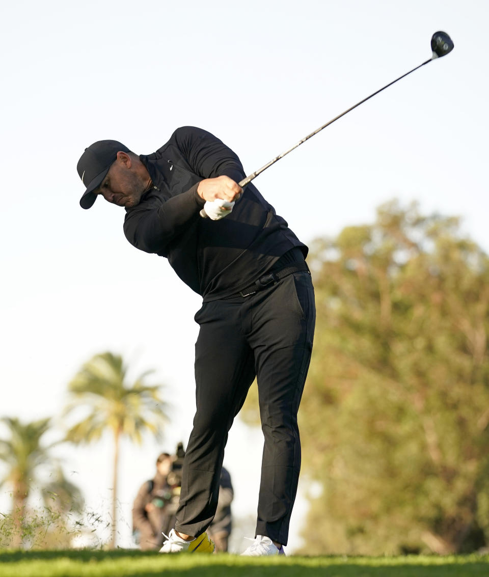 Brooks Koepka hits his second shot on the 12th hole during the first round of the Genesis Invitational golf tournament at Riviera Country Club, Thursday, Feb. 13, 2020, in the Pacific Palisades area of Los Angeles. (AP Photo/Ryan Kang)