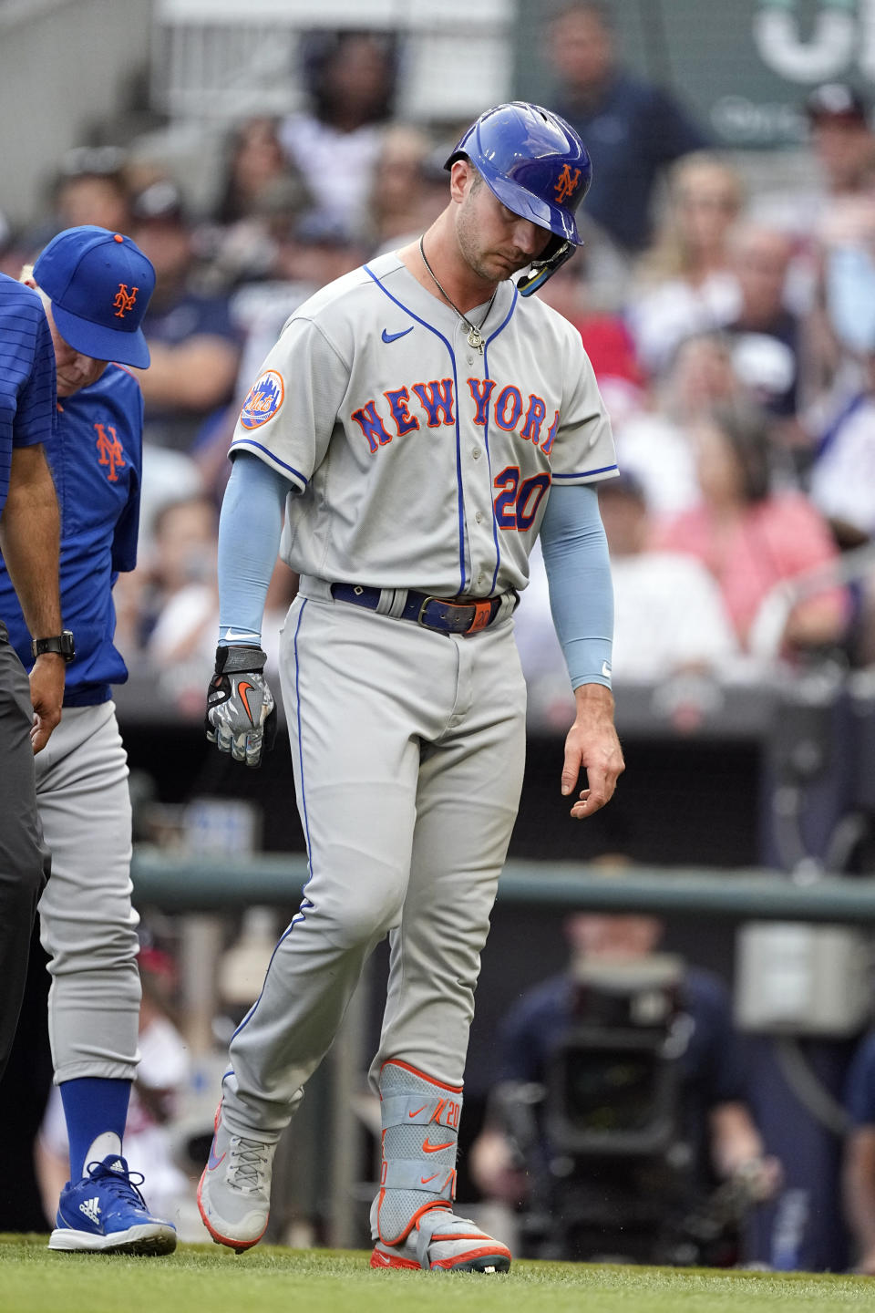 New York Mets first baseman Pete Alonso (20) leaves the field after being hit by a pitch from Atlanta Braves starting pitcher Charlie Morton (50) in the first inning a baseball game , Wednesday, June 7, 2023, in Atlanta. (AP Photo/John Bazemore)