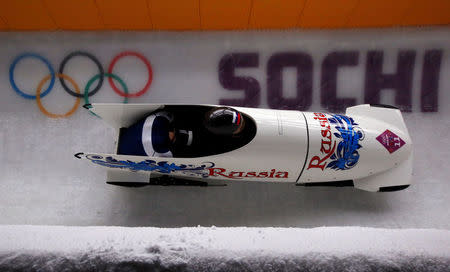 FILE PHOTO: Russia's pilot Olga Stulneva and Liudmila Udobkina speed down the track during the women's bobsleigh competition at the 2014 Sochi Winter Olympics February 18, 2014. REUTERS/Arnd Wiegmann/File Photo